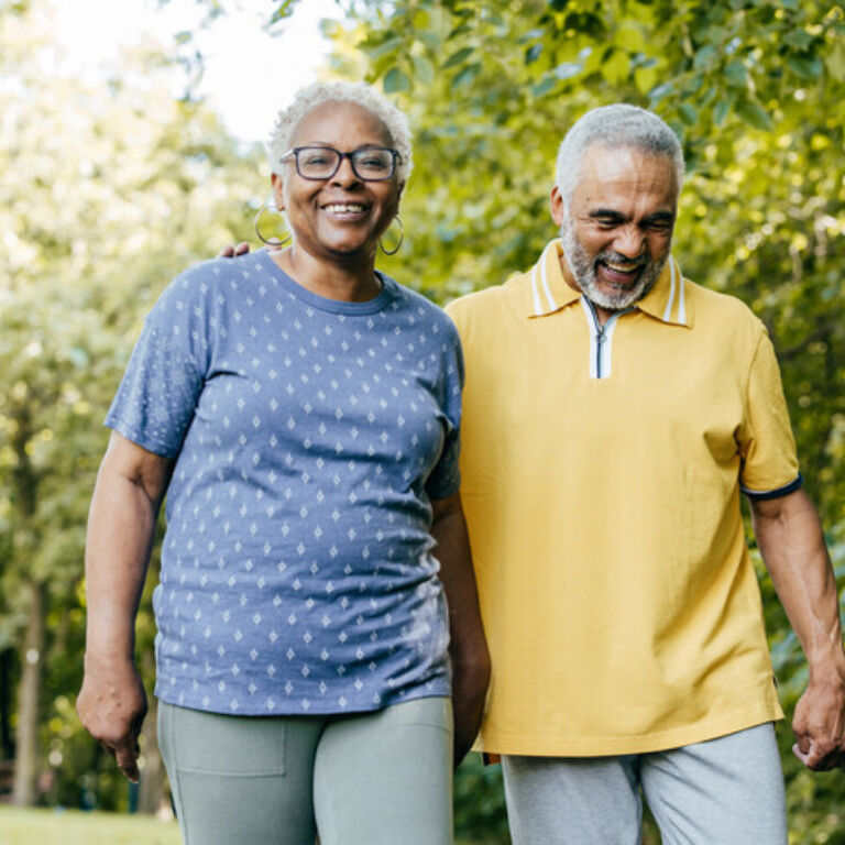 Large Man and Woman Walking Embraced 1