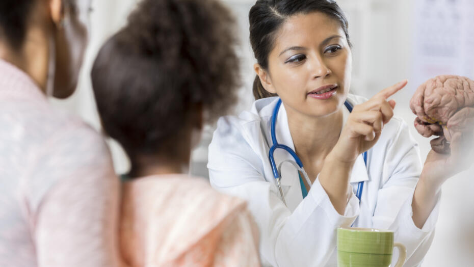 Doctor talking to mother and child Doctor talking to mother and child