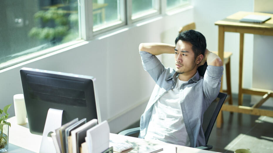 Man sitting at desk Man sitting at desk