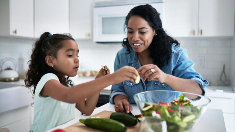 Mother daughter making food Mother daughter making food