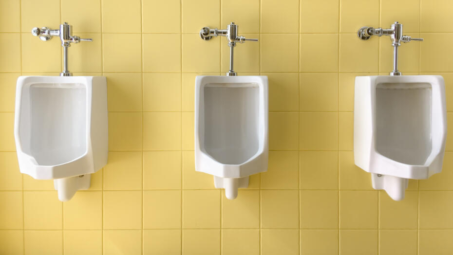 Why do I dribble when I pee Mens urinals against yellow wall Why do I dribble when I pee Mens urinals against yellow wall