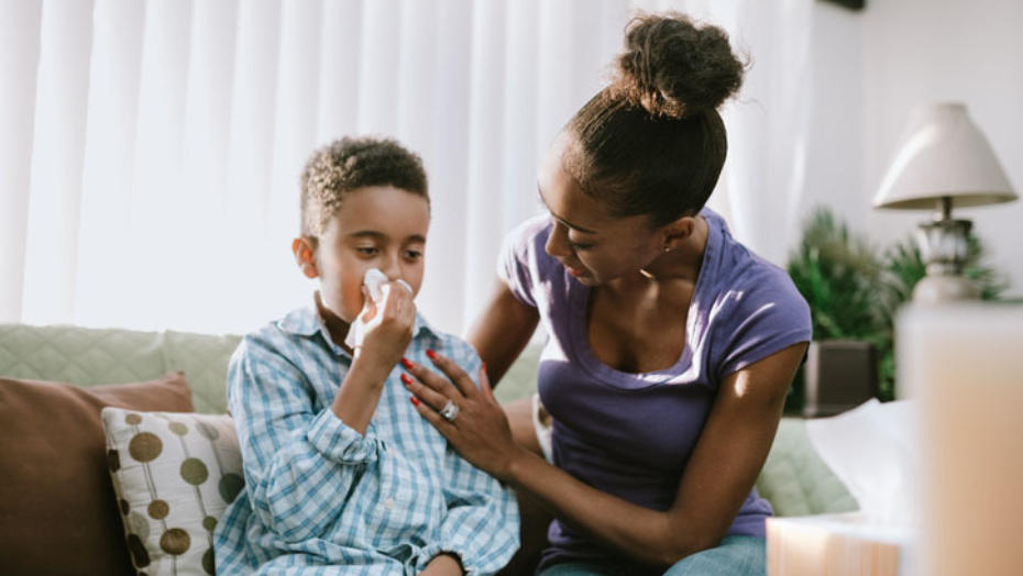 Child blowing nose Child blowing nose