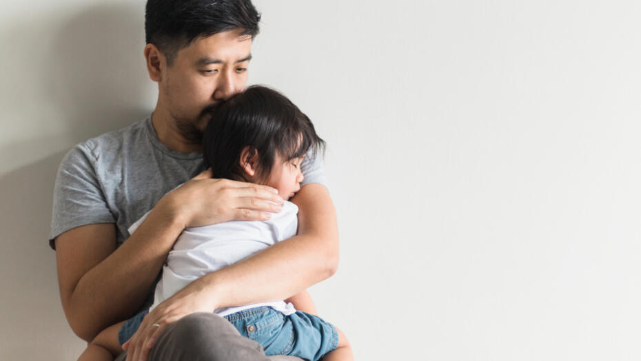 Father comforts son Father comforts son