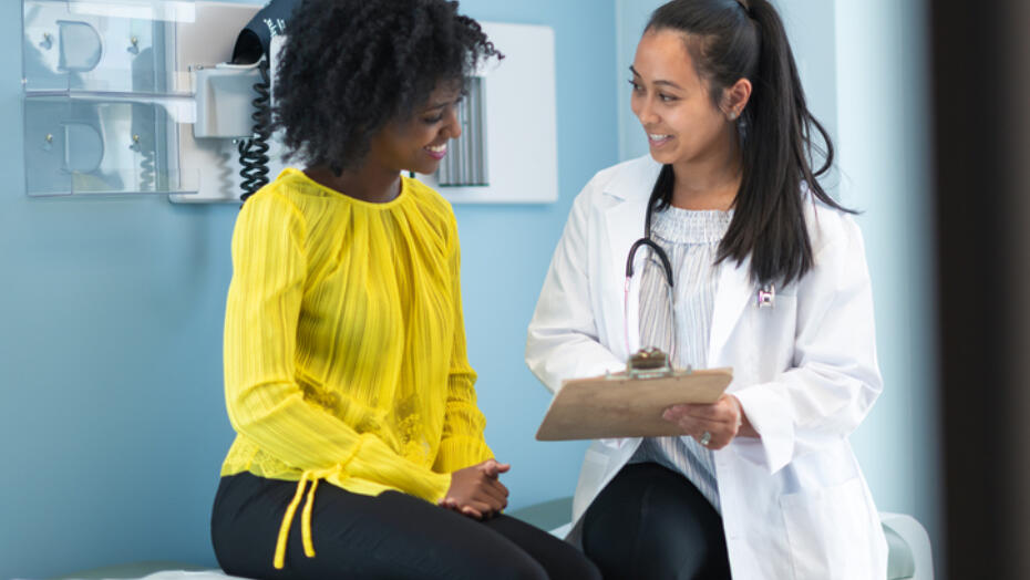 Woman speaking with doctor Woman speaking with doctor
