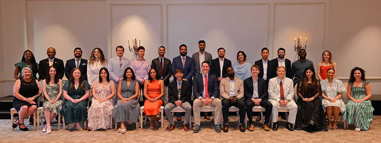 Group photo of Ochsner Health Internal Medicine residents and faculty posing together indoors.