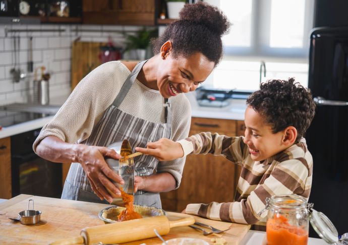 Mother and son baking healthy meal