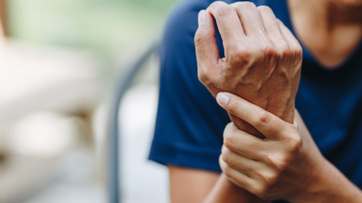 woman holding sprained wrist