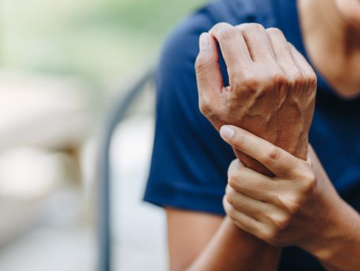 woman holding sprained wrist