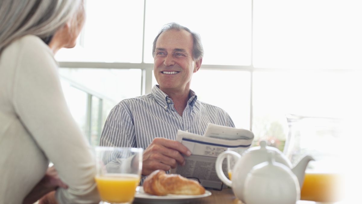 Man talking to Woman at Breakfast