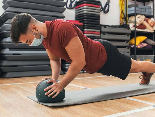 Young man doing planks