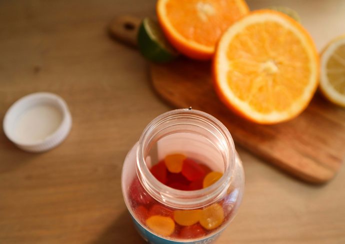 Multivitamins and slices of orange