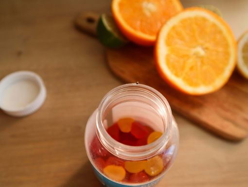 Multivitamins and slices of orange