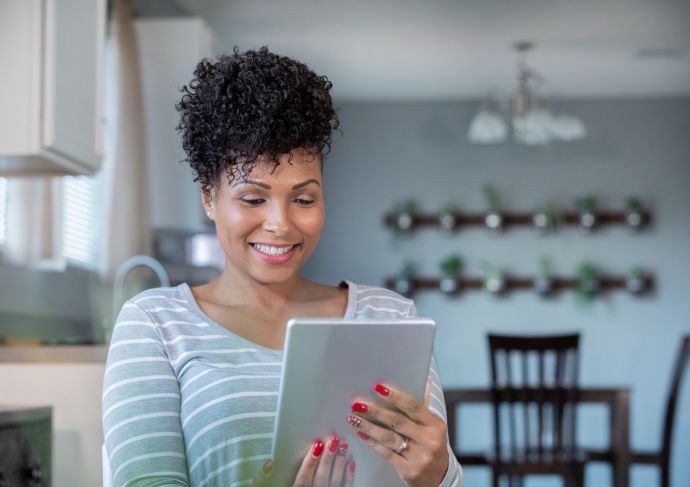 Telehealth female patient on her tablet during a virutal visit.