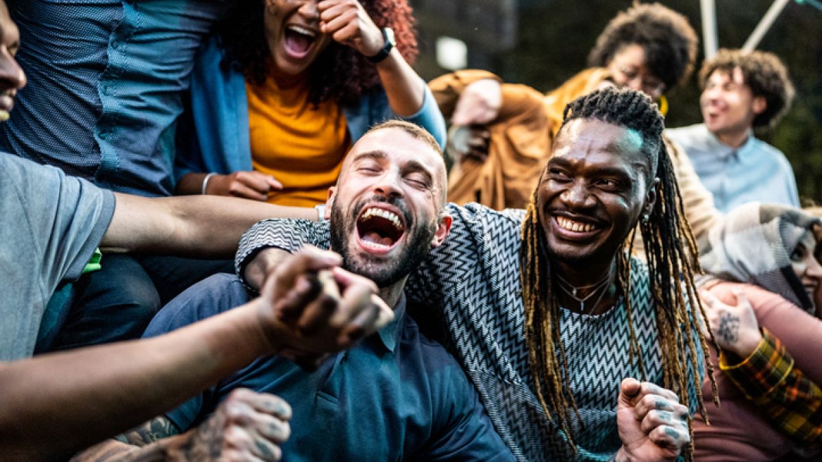 Fans cheering at football game