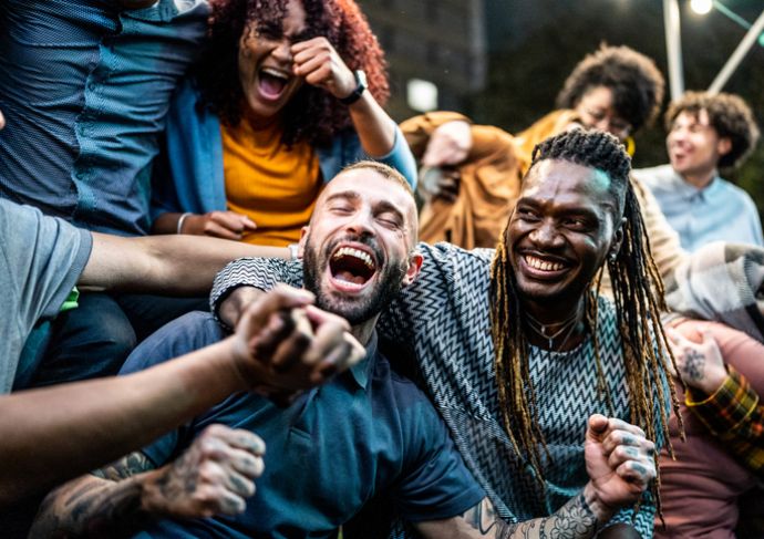 Fans cheering at football game