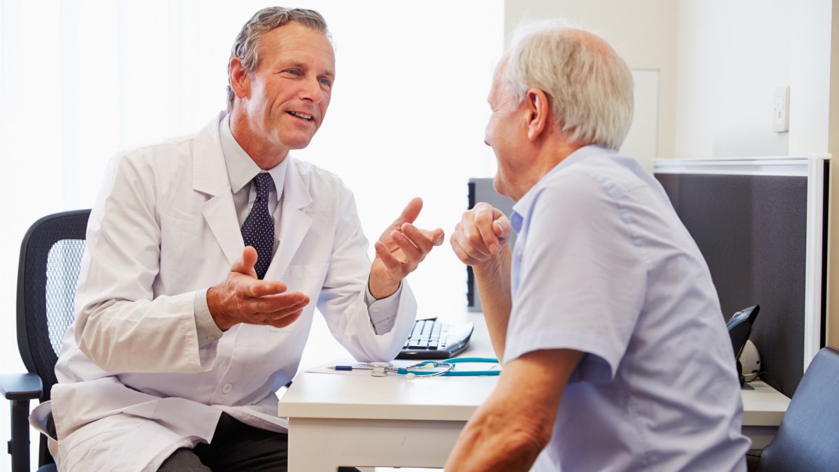 Senior man speaking to doctor