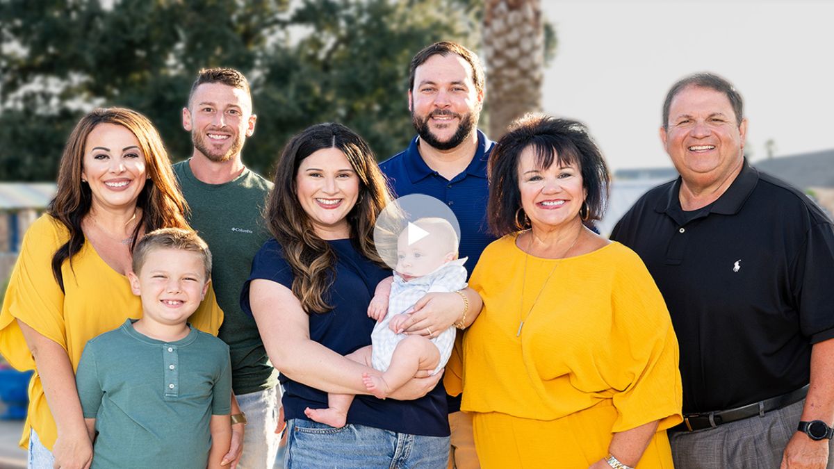 Brooke Pritchard pictured with family with the text breast cancer while pregnant
