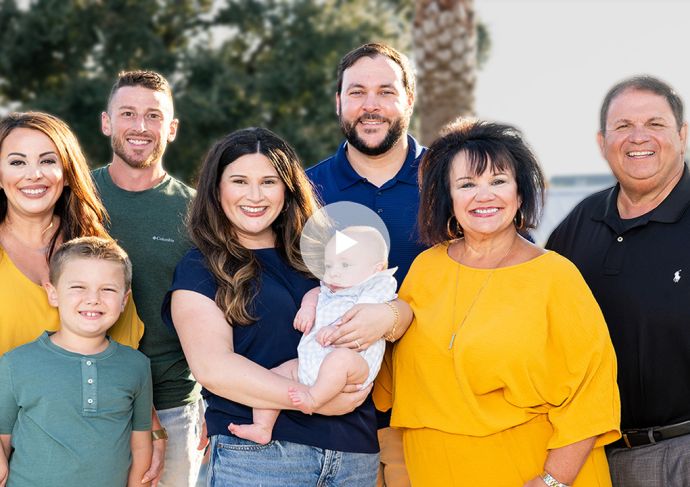 Brooke Pritchard pictured with family with the text breast cancer while pregnant