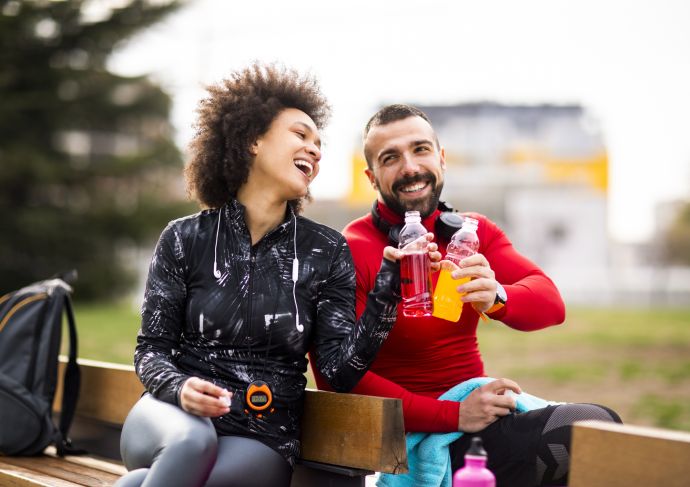 Runners drinking sports drinks