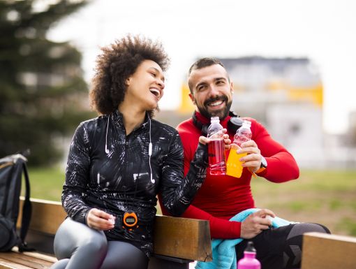 Runners drinking sports drinks