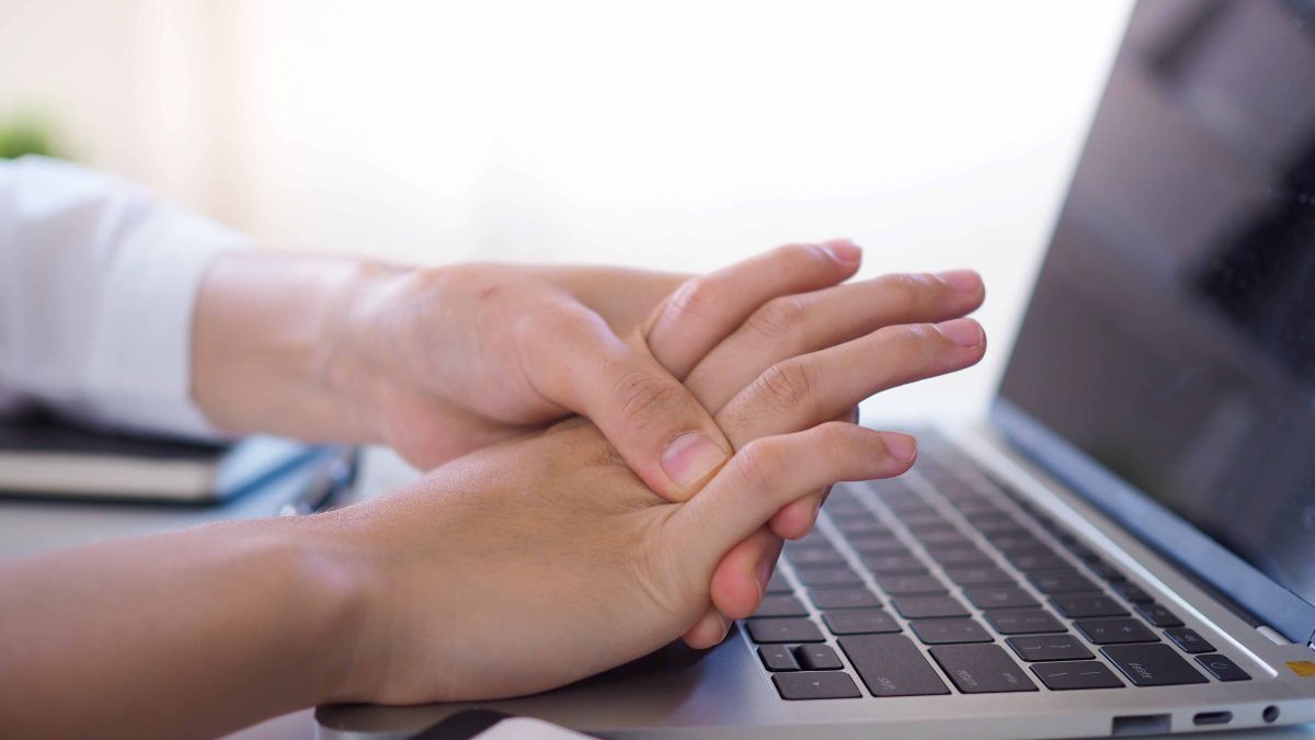 Person gripping fingers