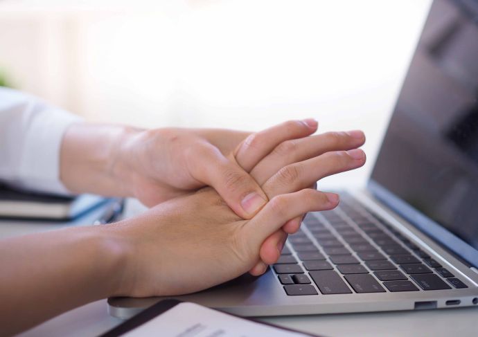 Person gripping fingers