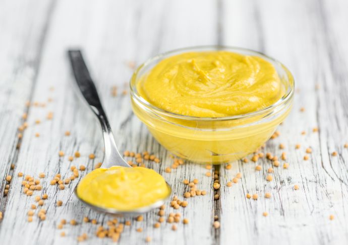 American yellow mustard in bowl