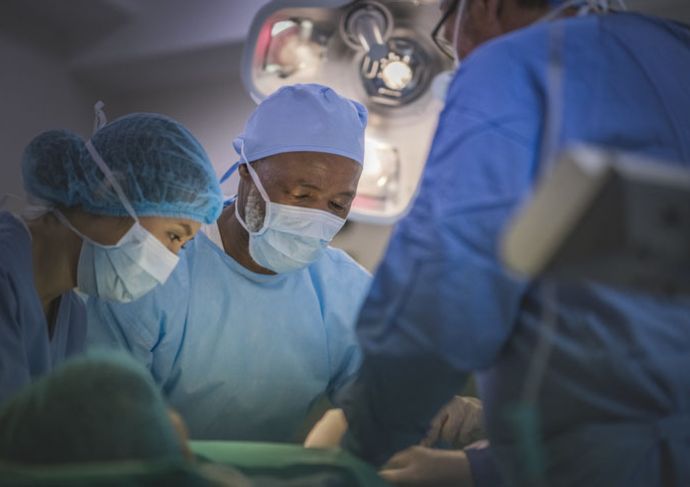 Surgeons performing surgery
