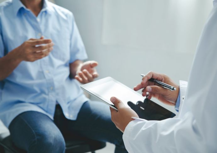 Patient explaining symptoms to a doctor
