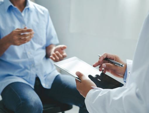 Patient explaining symptoms to a doctor