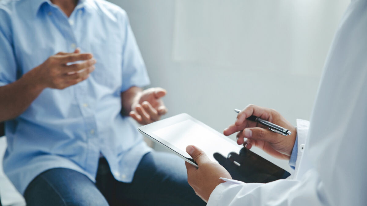 Patient explaining symptoms to a doctor