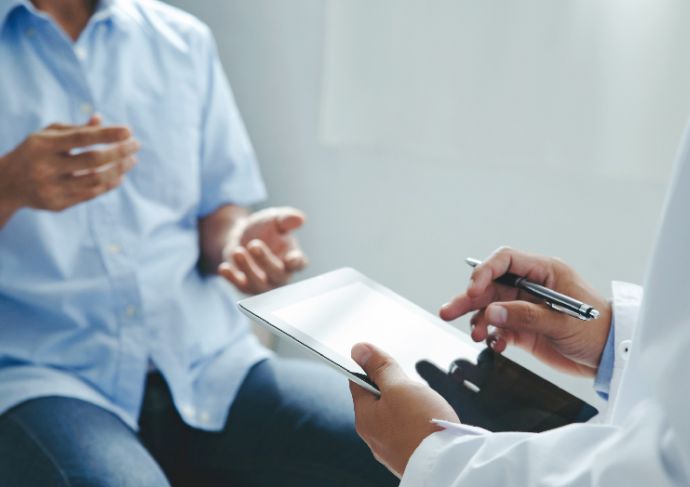 Patient explaining symptoms to a doctor