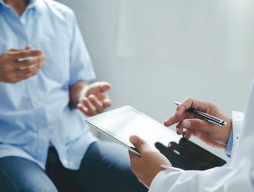 Patient explaining symptoms to a doctor