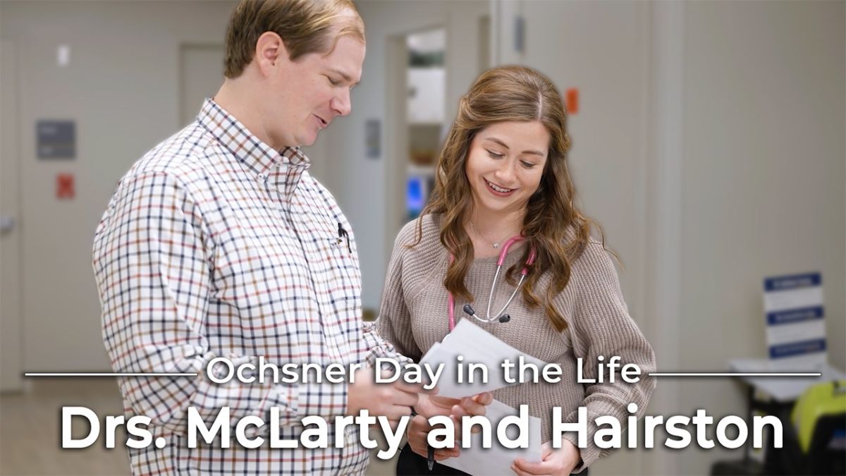 Image of Man and Woman looking with the text day in the life Drs Mc Larty and Hairston over it