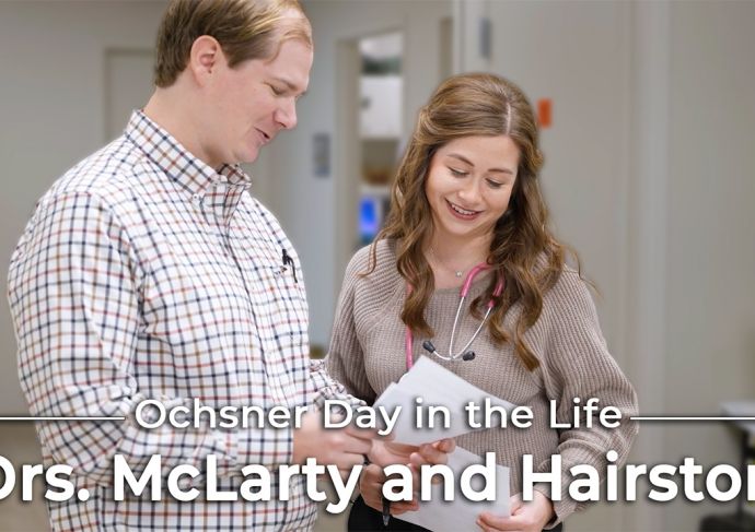 Image of Man and Woman looking with the text day in the life Drs Mc Larty and Hairston over it