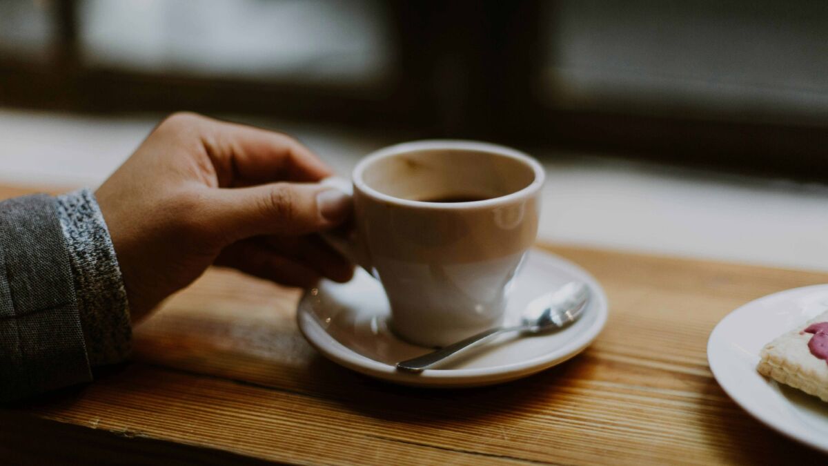 Cup of mushroom coffee on counter