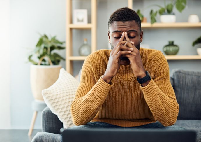 Man Stressed on Couch