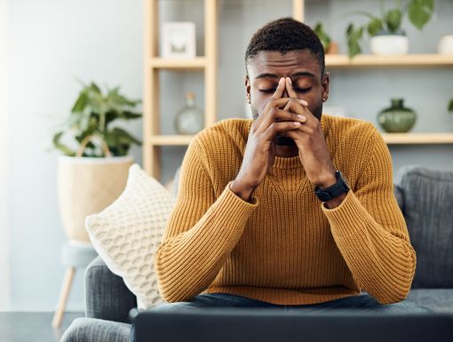 Man Stressed on Couch