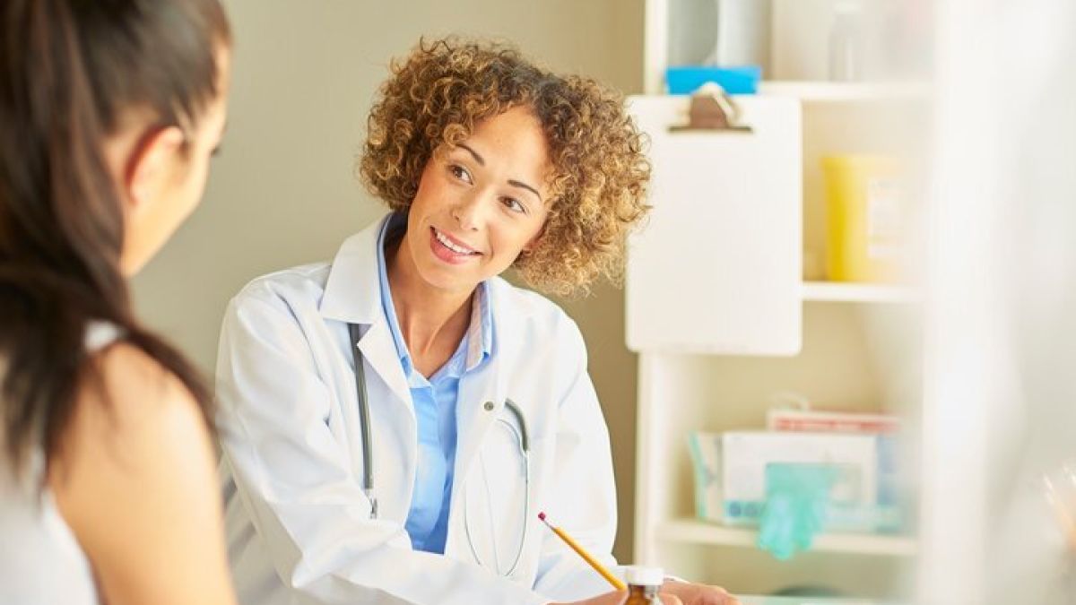 Doctor talking with patient