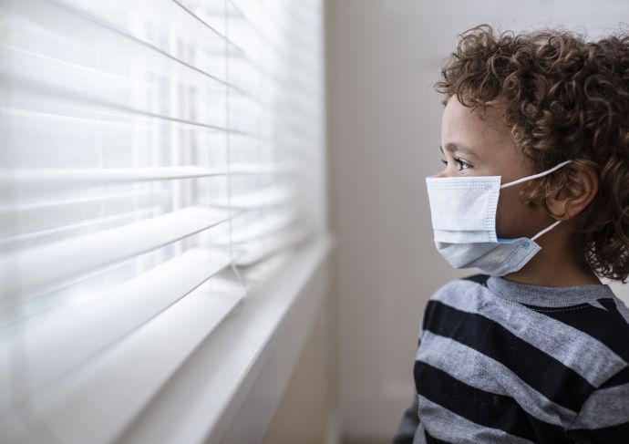 Minority Boy at Window