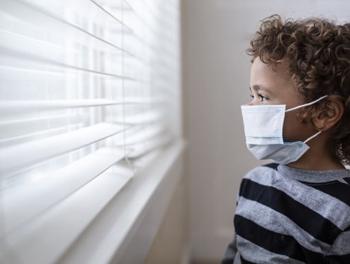 Minority Boy at Window