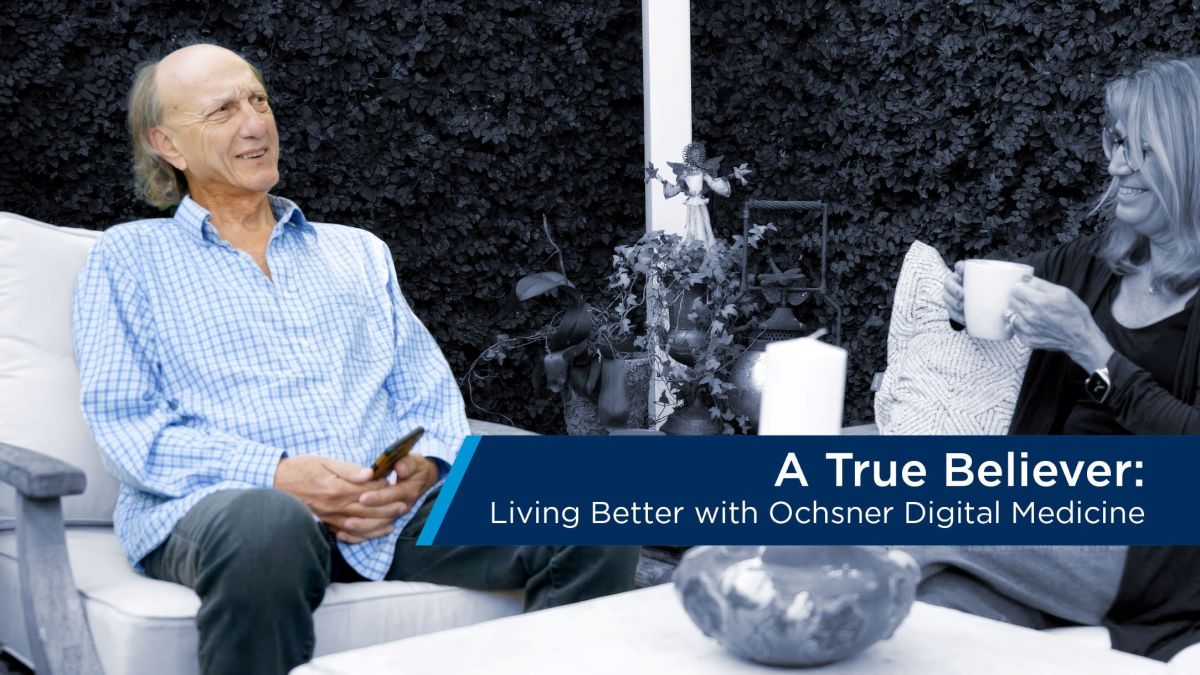 Man and woman seated in backyard text bar included