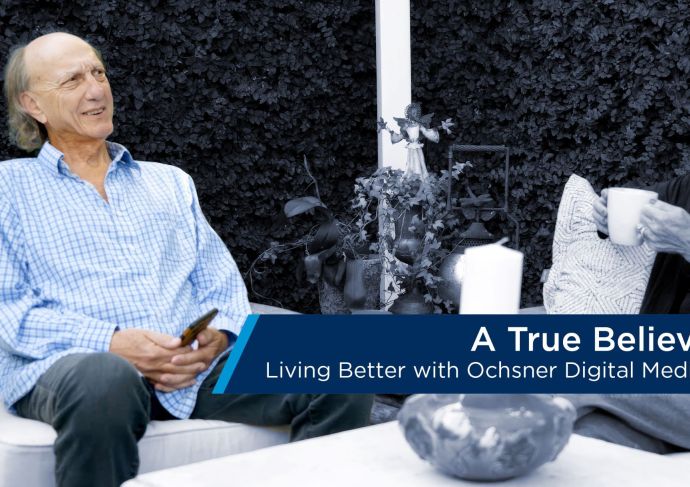 Man and woman seated in backyard text bar included