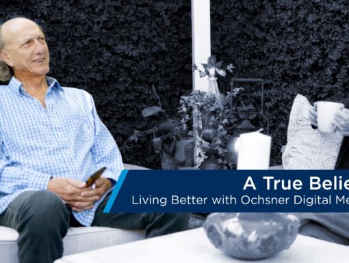 Man and woman seated in backyard text bar included