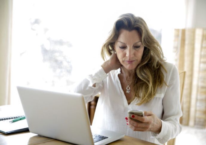 Older woman looking at her phone