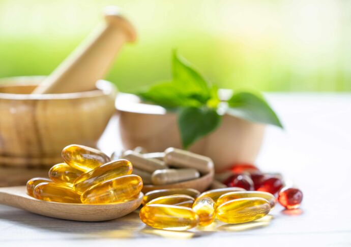 Vitamins and herbal supplements on table