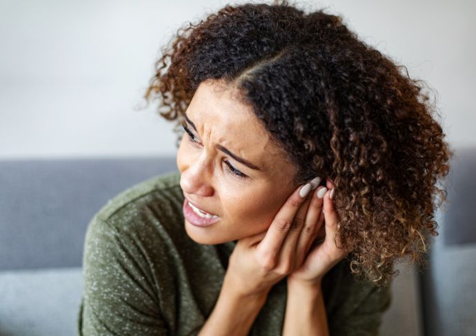 Woman having ear pain