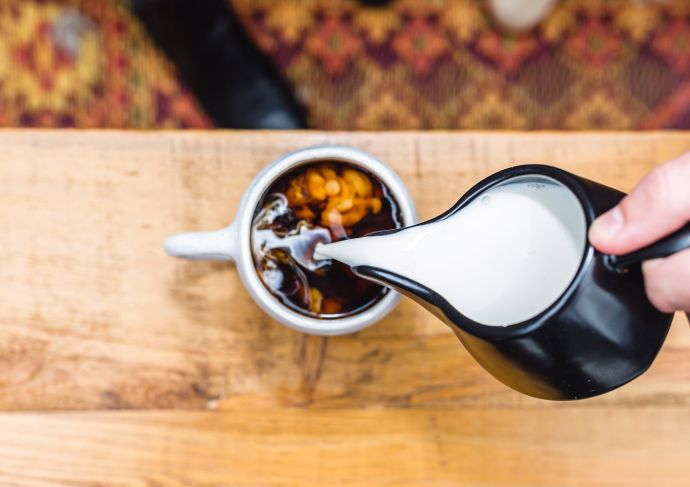 Plant Based Creamer poured in coffee