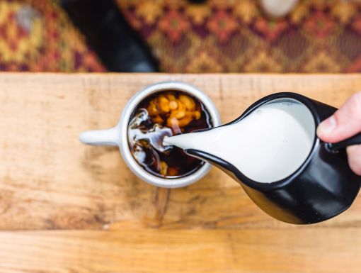 Plant Based Creamer poured in coffee