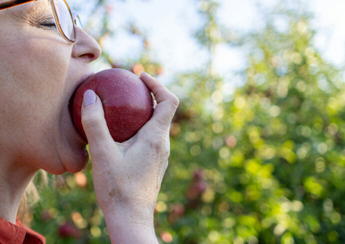 Woman eating apple
